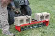 36 inch spike aerator being used to aerate lawn.