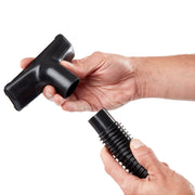 Photo of CRAFTSMAN vacuum accessory CMXZVBE38762, black plastic brush nozzle, held in hand, white background.